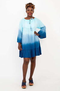 Front view of a model wearing a blue ombre boho Ellie Dress with flounce hem and ruffle sleeves