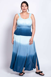 Front view of a model wearing a blue ombre maxi dress with wide straps and side slits