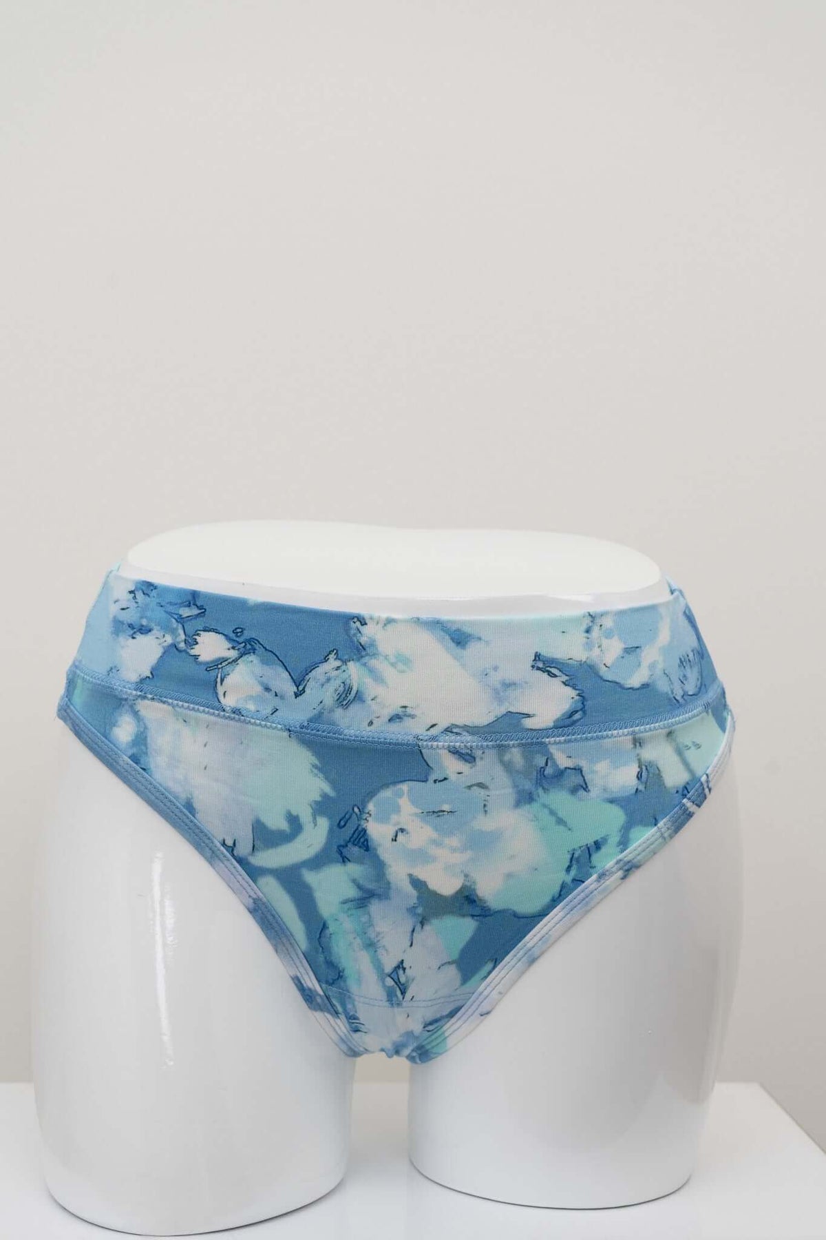 Front view of high rise blue patterned thong underwear on mannequin