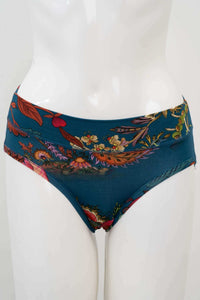 Front view of teal hipster underwear with vibrant floral print on mannequin