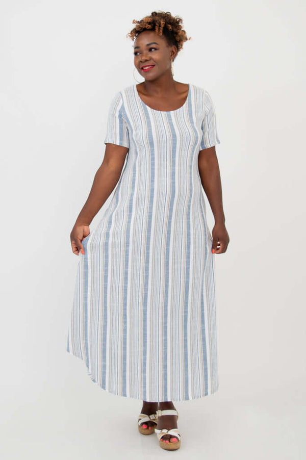 Woman modeling a flowy striped maxi dress with short sleeves, front view
