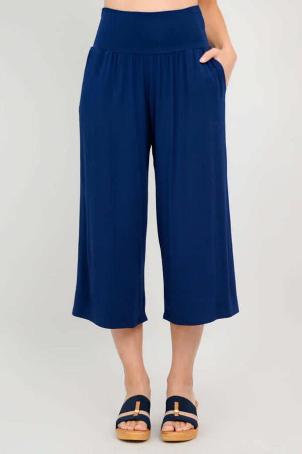 Front view of gaylene bamboo capri pants with hand in pocket, royal blue color