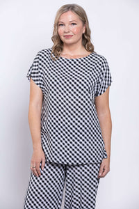 Front view of a woman wearing a black and white gingham linen blend tee