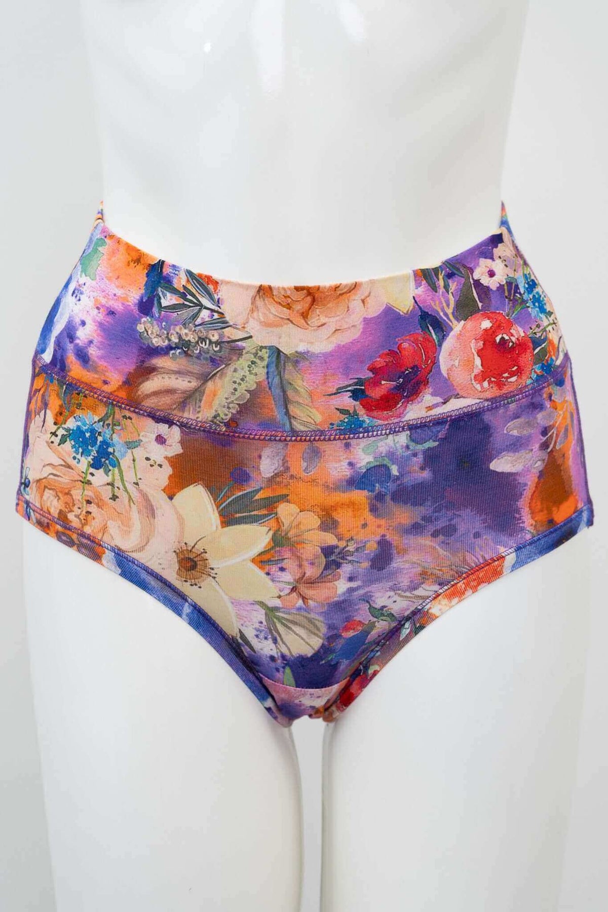 Front view of high-waist bamboo brief in vibrant floral print on mannequin
