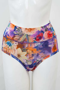 Front view of high-waist bamboo brief in vibrant floral print on mannequin