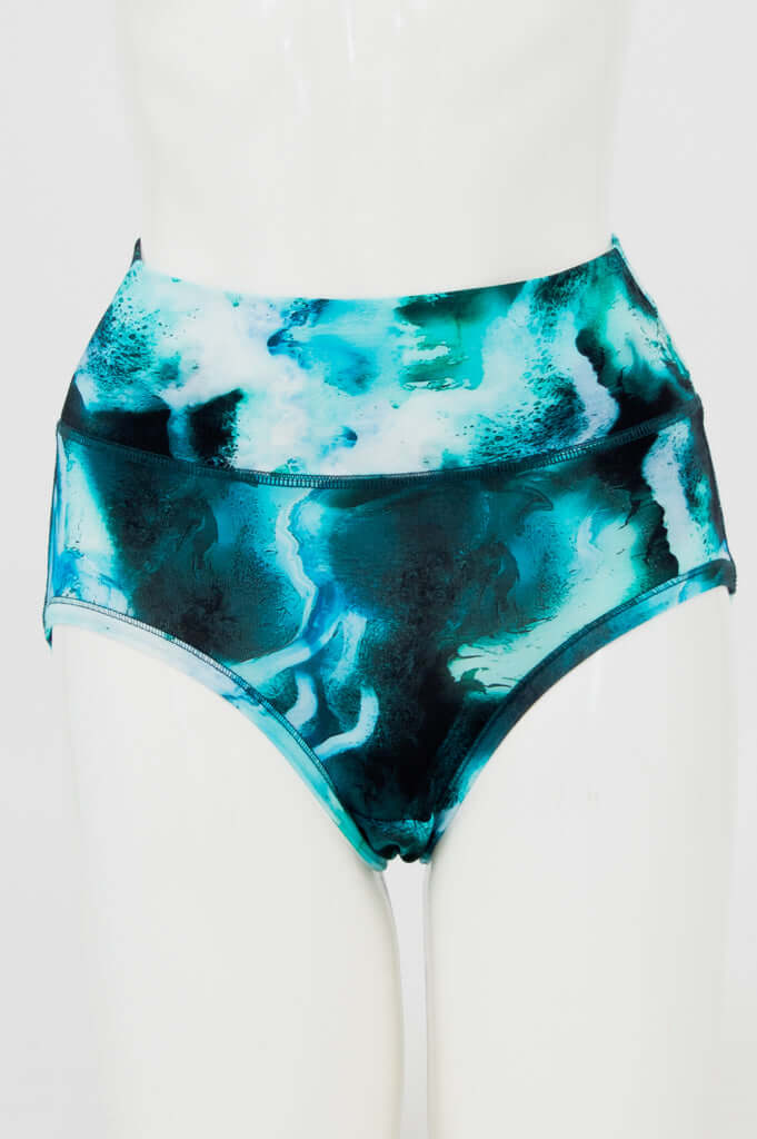 Front view of high-waisted brief with aqua marble print on mannequin