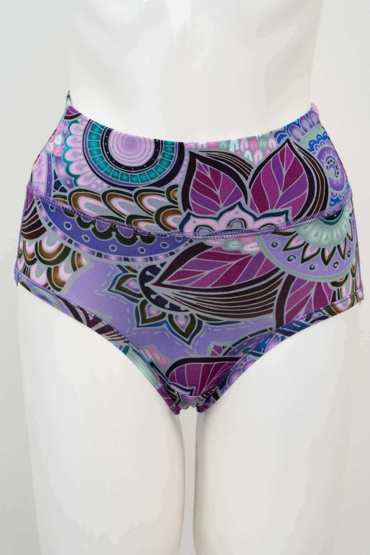 Front view of high-waisted brief with vibrant mandala and leaf print in purple and teal