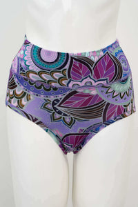 Front view of high-waisted brief with vibrant mandala and leaf print in purple and teal