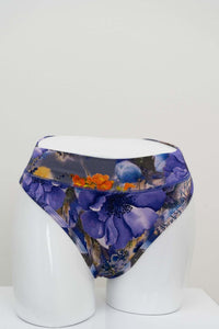 Front view of high rise bamboo thong underwear with purple floral print on mannequin
