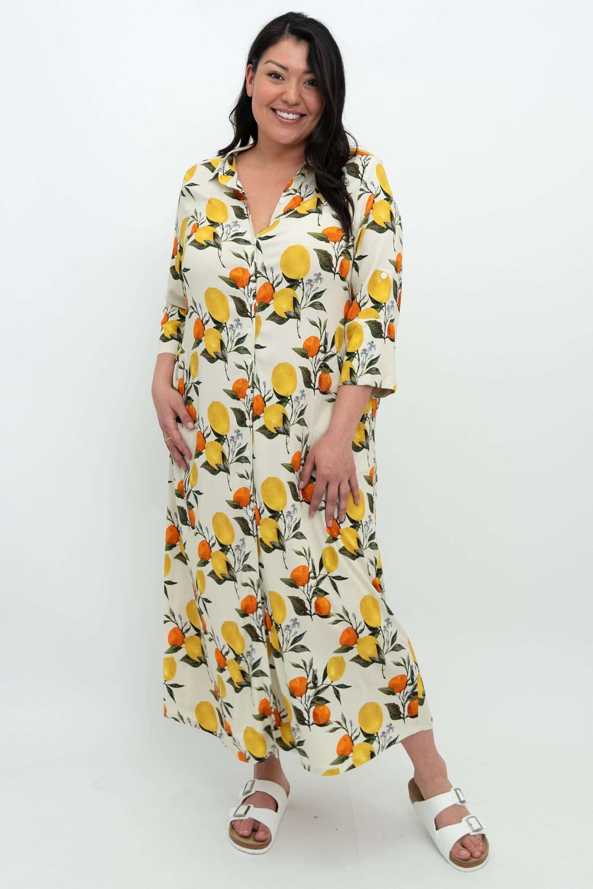 Front view of woman wearing a linen bamboo citrus maxi shirt dress with ¾ sleeves