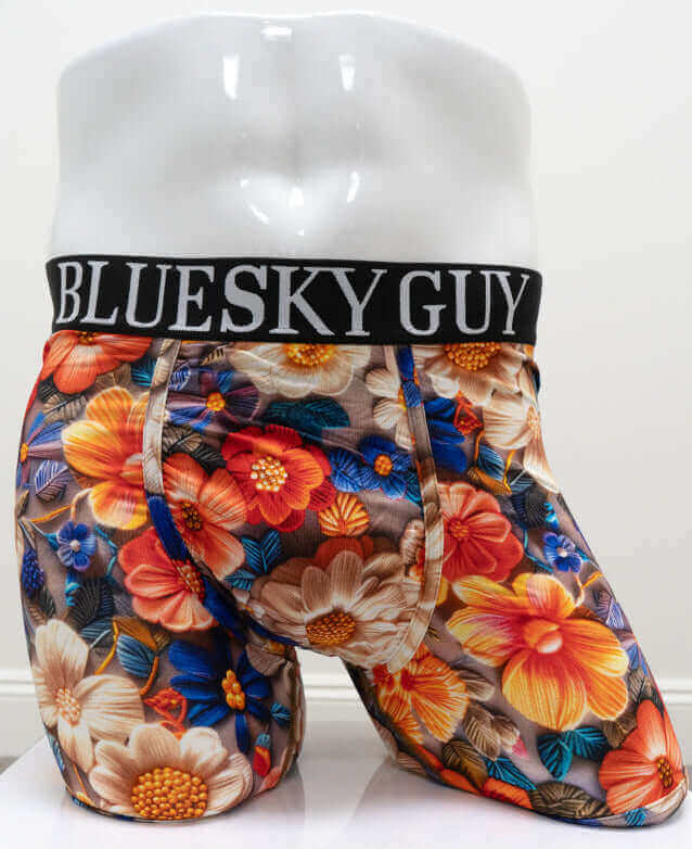 Front view of men's boxer briefs with bold multicolor floral pattern and black Blue Sky Guy waistband