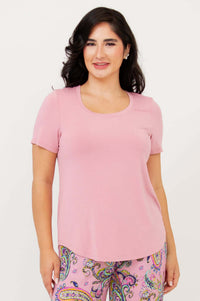 Front view of model wearing light pink Tessa Tee and paisley pants
