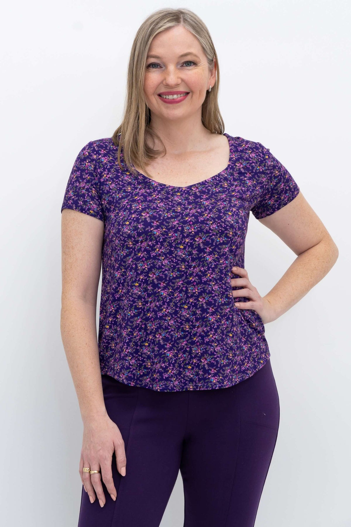 Front view of model wearing purple floral Ritzy Short Sleeve Top
