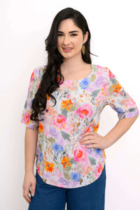 Front view of model wearing Liza floral bamboo linen blouse with elbow-length sleeves