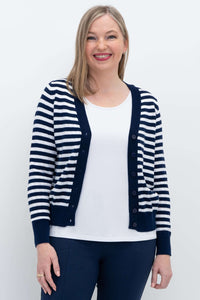 Front view of woman wearing a navy and white Breton striped cropped cardigan
