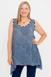Front view of a woman wearing a navy stripe swing tank top with elongated sides