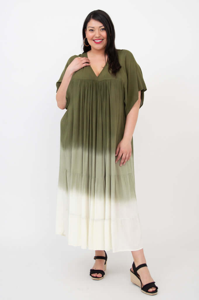 Front view of a woman wearing an olive ombre tiered maxi dress with short sleeves