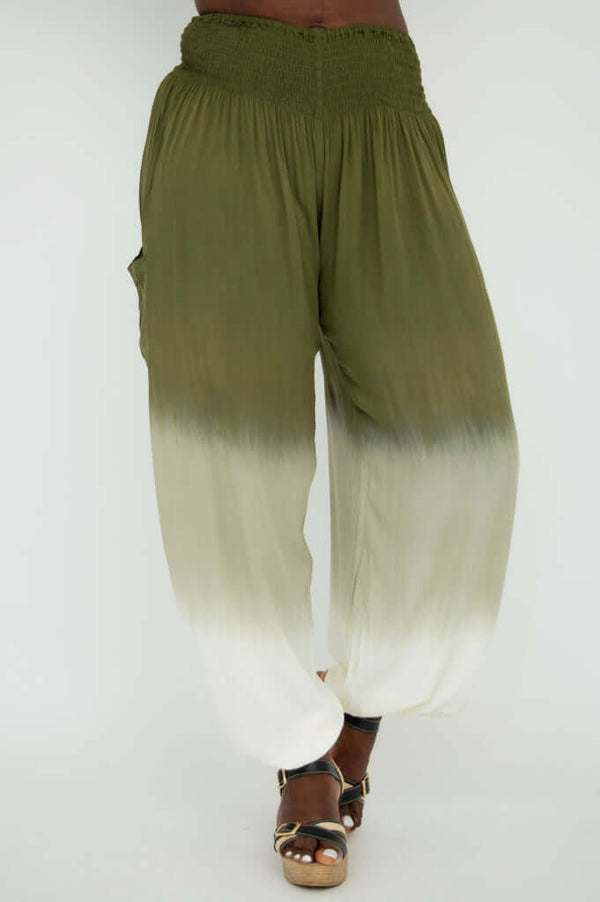 Front view of olive to cream ombre pants with elastic waistband, model wearing sandals