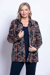 Front view of a woman wearing a plaid cotton jacket over a navy top