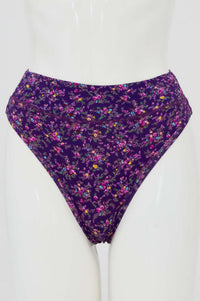 Front view of a high rise purple thong underwear with a colorful floral print