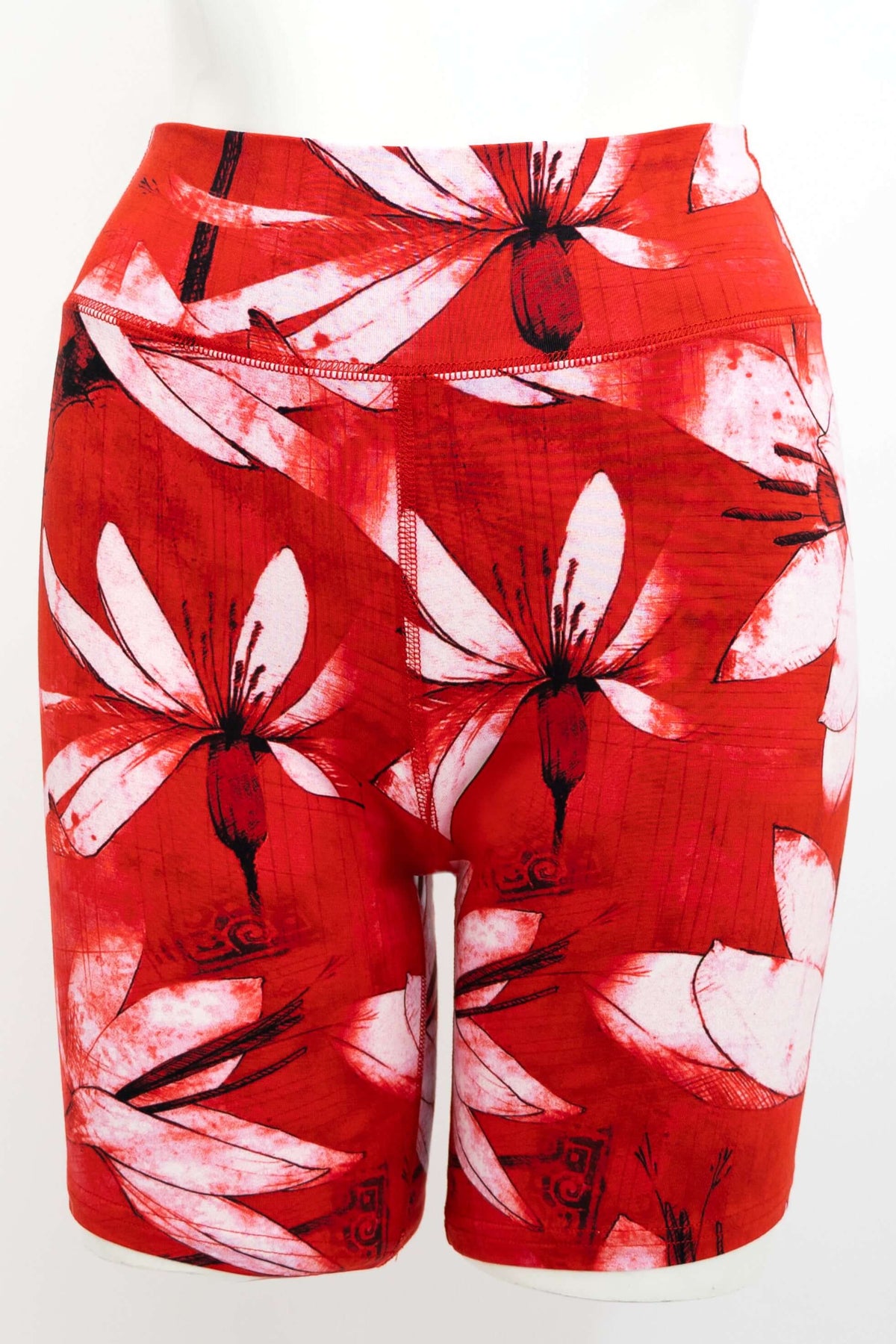 Front view of red floral Hallie Bamboo Shorts with white lilies and flatlock seams
