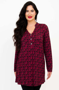 Front view of model wearing the Edwina tunic with red and black floral pattern