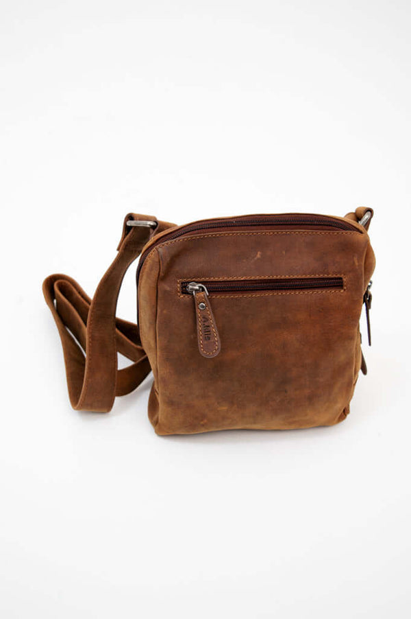 Front view of a vintage brown leather crossbody bag with zip pocket