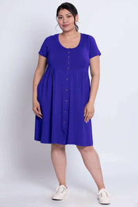 Front view of woman wearing violet short sleeve bamboo dress with button front