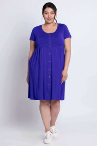 Front view of violet bamboo dress with empire waist and button details