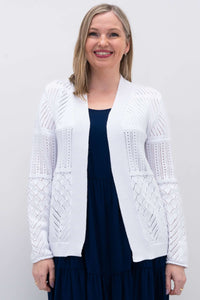 Front view of woman wearing a white pointelle knit open cardigan