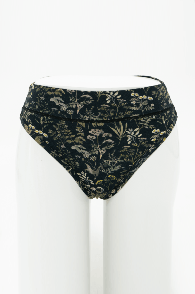 Front view of high rise thong underwear in black with wildflower print