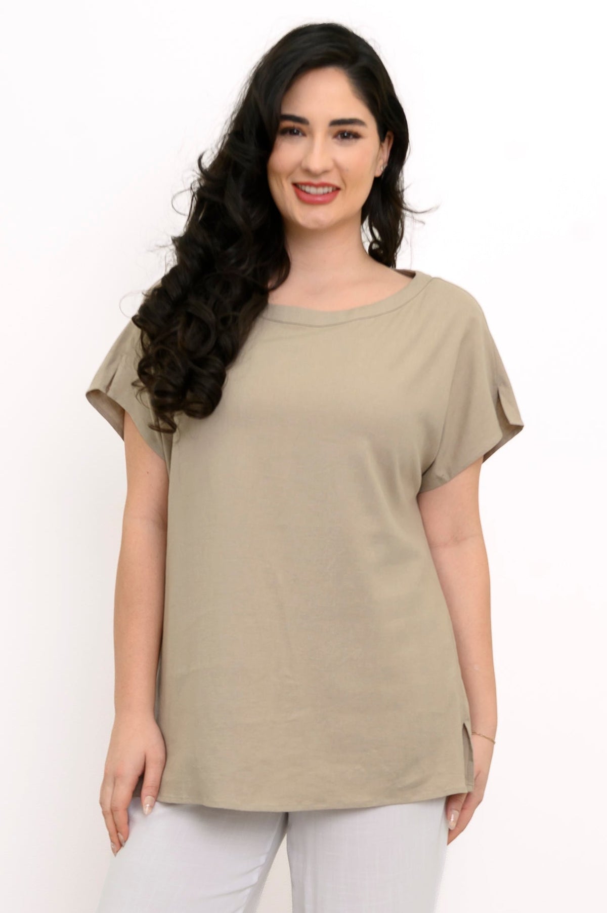 Front view of woman in beige dolman sleeve tee with boatneck