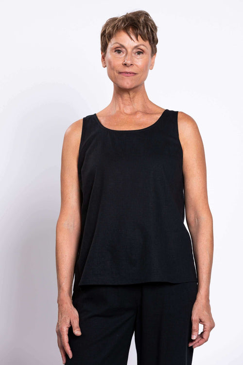 Front view of woman wearing a classic black sleeveless tank top