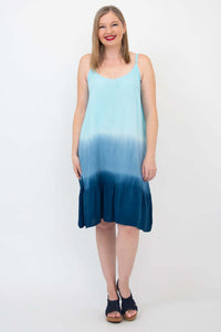 Front view of woman in sleeveless ombre aqua sundress with scoop neckline