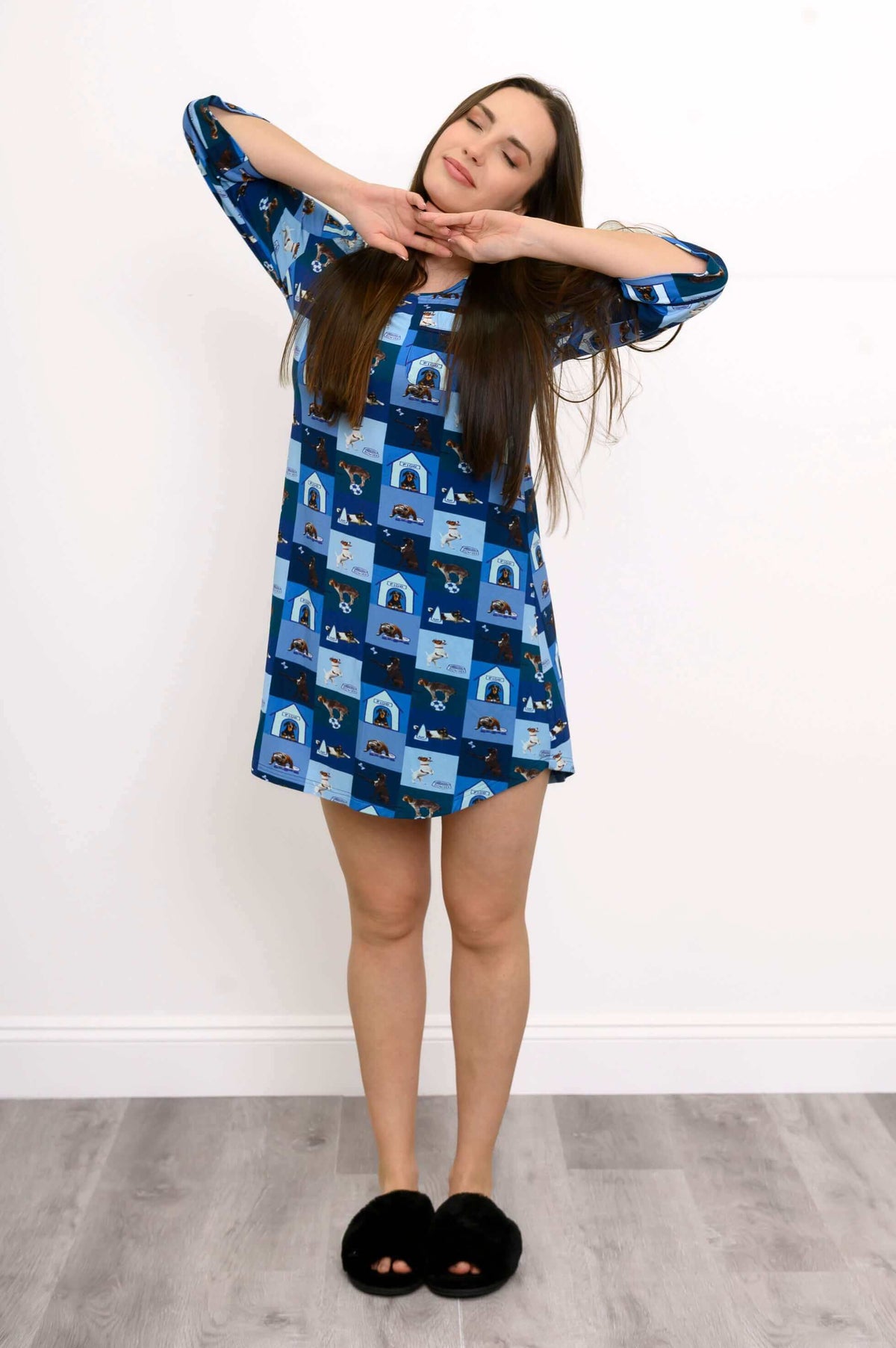Front view of woman wearing blue dog print sleepshirt with 3/4 sleeves