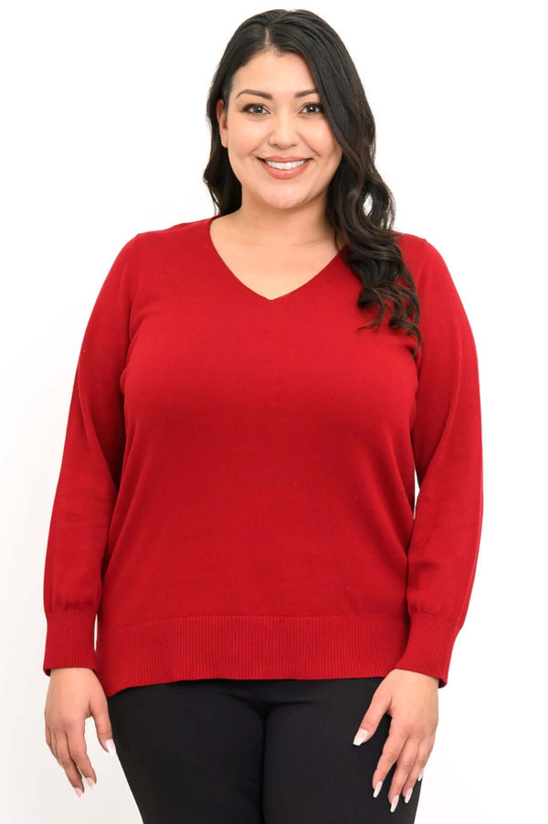 Front view of woman wearing a red V-neck sweater with long sleeves