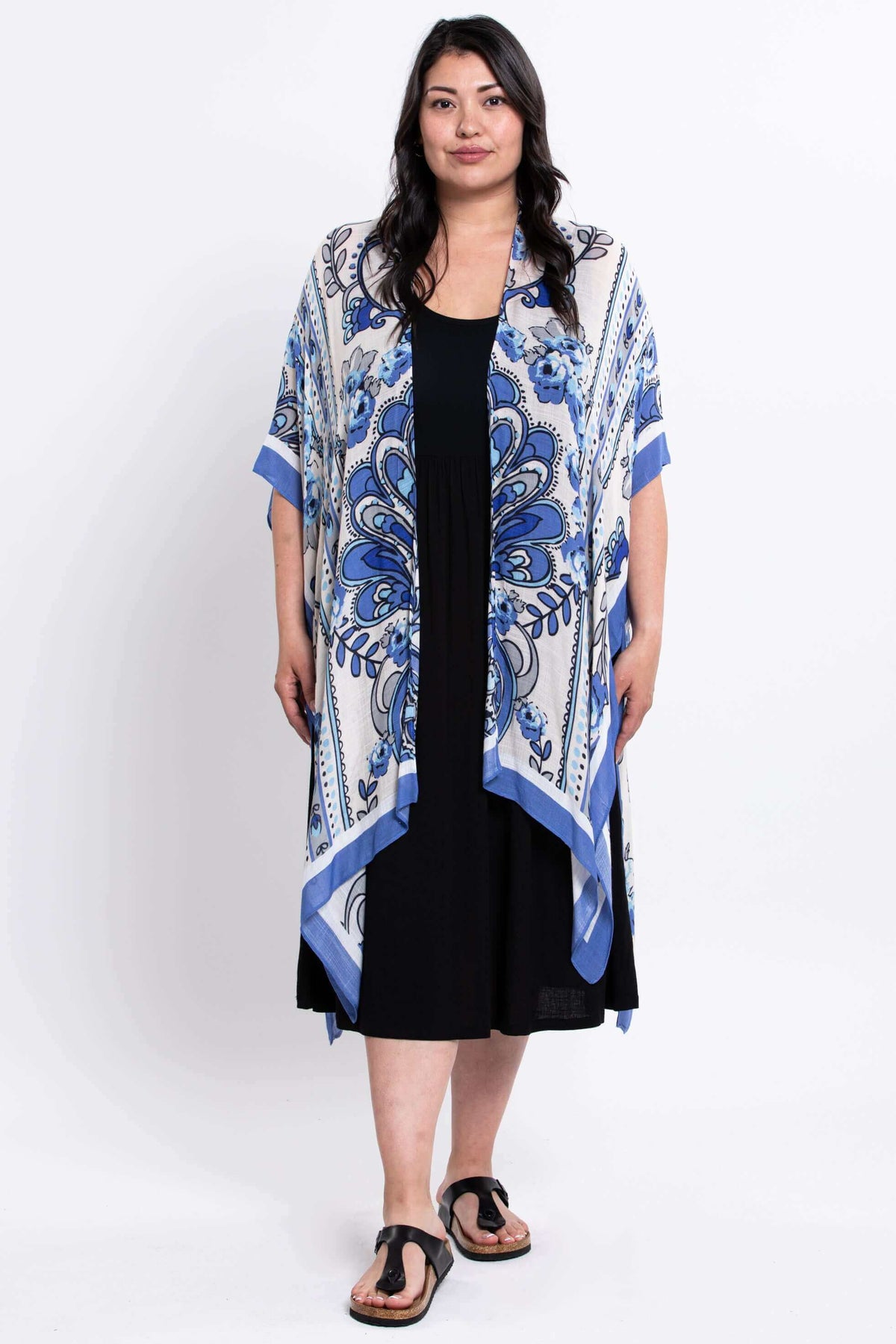 Full-body view of a woman modeling the Darcy blue floral kimono wrap
