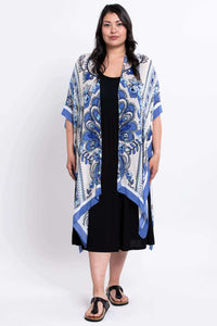 Full-body view of a woman modeling the Darcy blue floral kimono wrap
