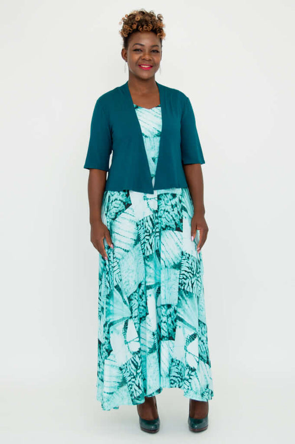 Full-length view of model wearing teal cropped jacket and blue maxi dress
