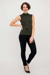 Full-length shot of model wearing the sleeveless Rita Merino Wool Sweater and black pants