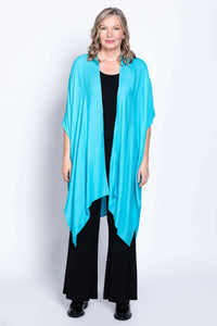 Full view of woman modelling turquoise Darcy kimono wrap, hands at sides