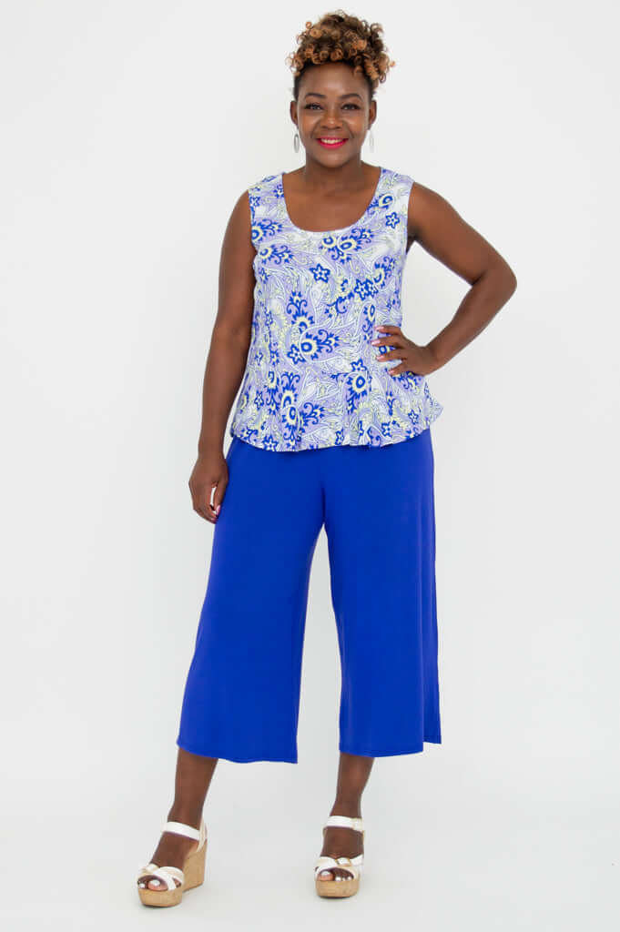 Full body view of model in Ginny Tank and royal blue culottes with white wedges