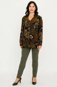 Full body view of model in Shirley Batik Art print top and green pants