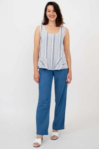 Full body view of model in Ginny Tank paired with blue pants and white sandals