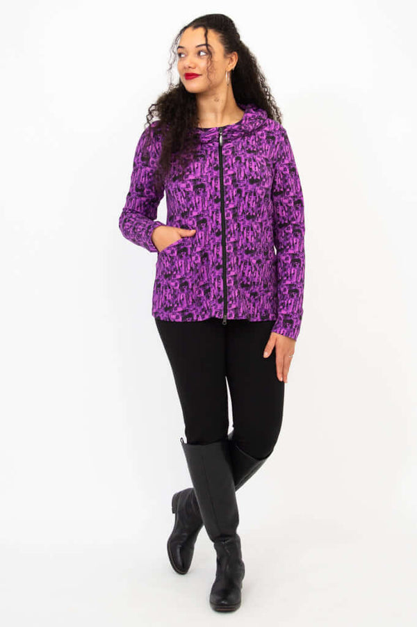 Full body view of model in Seymour bamboo hoodie, hands in pockets