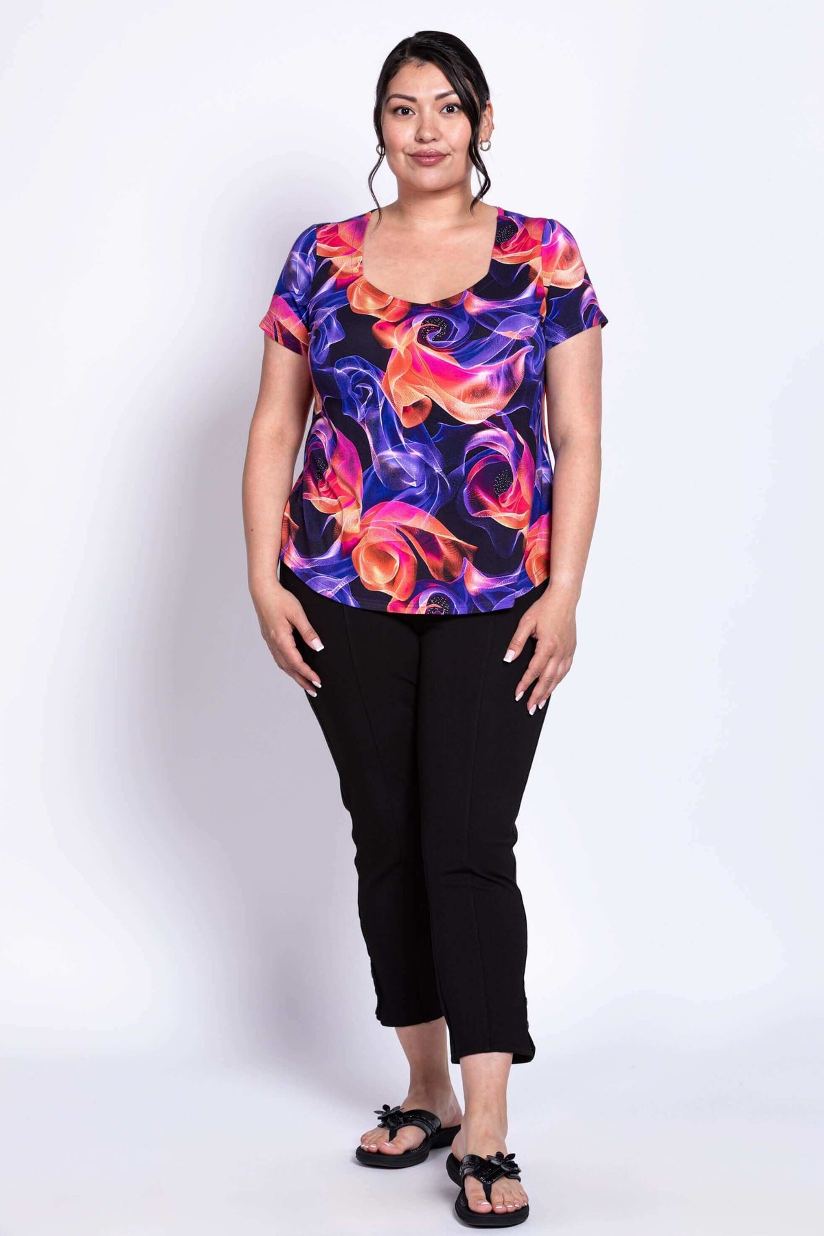 Full body front view of model in Ritzy Short Sleeve Top and black pants