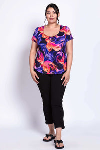 Full body front view of model in Ritzy Short Sleeve Top and black pants