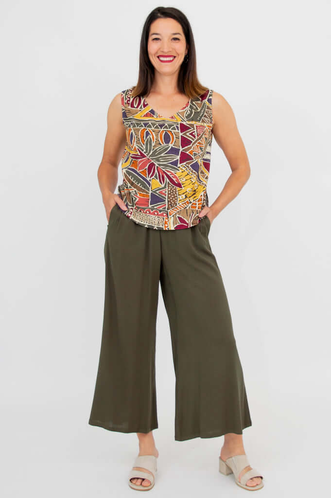 Full length front view of a woman in a sleeveless printed tank and wide leg pants