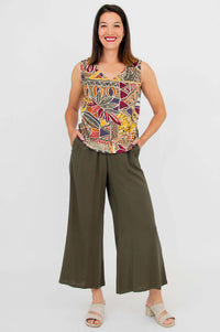 Full length front view of a woman in a sleeveless printed tank and wide leg pants