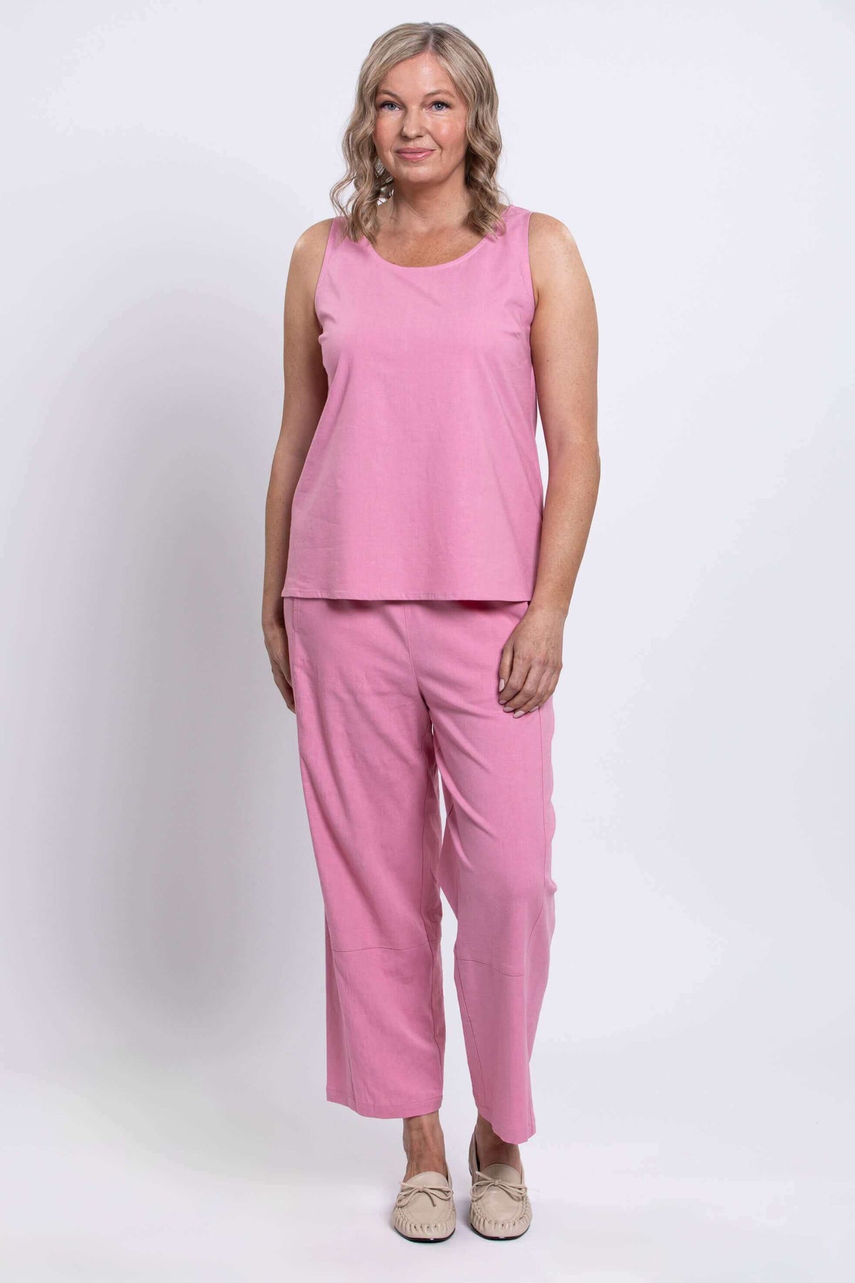 Model in pink Boardwalk Pants and sleeveless top, standing forward, full body view
